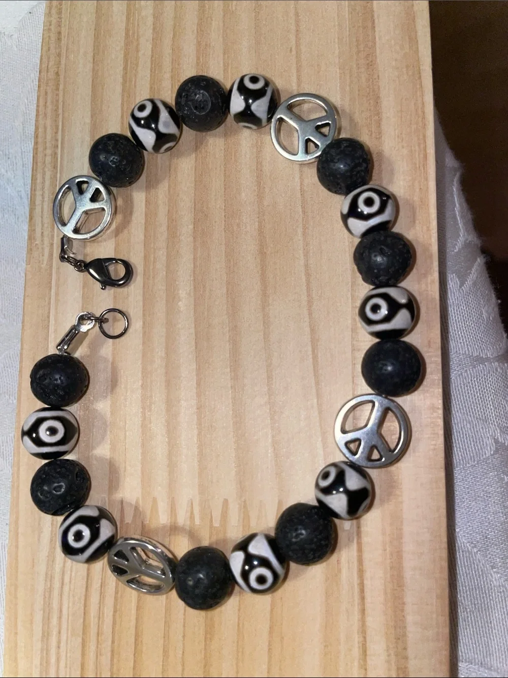 9-Bead Tibetan polish bead Anklet with lava beads and peace signs.
